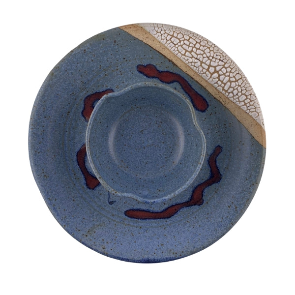 Ceramic plate with blue glaze, red accents, and a textured rim on a white background | Blue Bubble Wavy Dip Plate | Parsons Dietrich | boogie + birdie