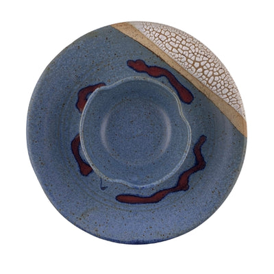 Ceramic plate with blue glaze, red accents, and a textured rim on a white background | Blue Bubble Wavy Dip Plate | Parsons Dietrich | boogie + birdie