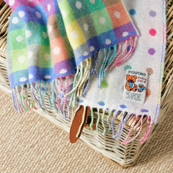 Rainbow Multi-Spot Lambswool Baby Throw | Foxford | Shop a selection of baby products at boogie + birdie